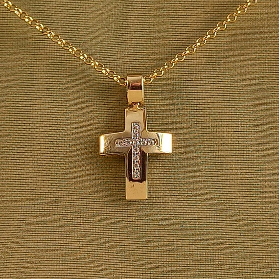 Cross with cubic zirconia stones in 14 ct. solid yellow gold