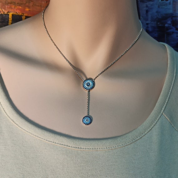Necklace with two evil eyes in sterling silver with AAAAA quality cubic  zirconia stones
