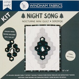 May include: A quilting kit for a "Night Song" mini quilt. The kit includes fabric, pattern, backing, English paper piecing templates, and instructions. The quilt is 12 inches by 16 inches.