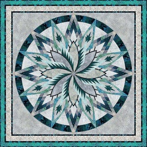 May include: A square quilt with a central floral design in shades of teal, gray, and white. The design is surrounded by a dark teal border and a white and gray patterned background. The quilt has a geometric, star-like pattern.