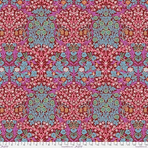 May include: A patterned fabric featuring a repeating floral design in shades of burgundy, teal, purple, and pink. The intricate pattern includes stylized flowers, leaves, and vines, creating a rich and detailed visual texture. The fabric has a vintage or Victorian aesthetic.