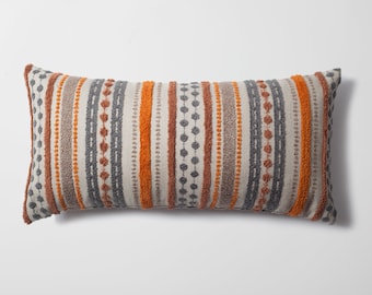 Orange and top grey pillows