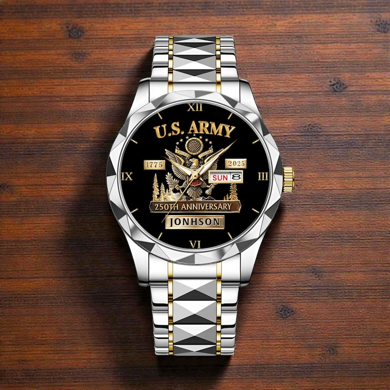 May include: Silver and gold-toned wristwatch with a black face. The watch face features the text "U.S. ARMY" above an eagle emblem, with "1775" and "2025" on either side. The watch also displays "250TH ANNIVERSARY" and the name "JONHSON".