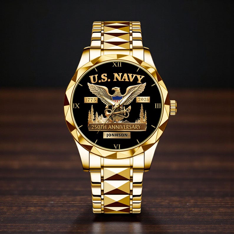 May include: A gold-toned wristwatch with a black face featuring the text "U.S. NAVY" and an eagle emblem. The watch commemorates the "250th ANNIVERSARY" and includes the years 1775 and 2025. The watch band is also gold-toned.