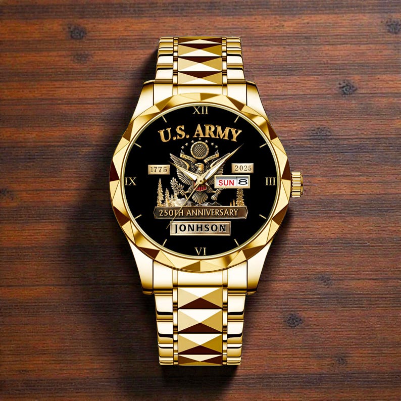 May include: A gold-toned wristwatch with a black face featuring the text "U.S. ARMY", an eagle emblem, and the text "250TH ANNIVERSARY". The watch also displays the date and the name "JONHSON".