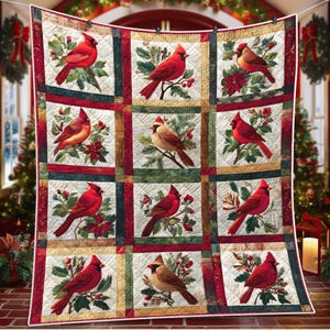 May include: A quilted blanket featuring a repeating pattern of red cardinal birds perched on branches with berries and leaves. The squares are bordered by red, green, and cream-colored fabric. The overall design has a festive, holiday theme.