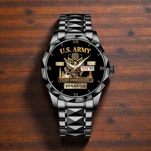 May include: A black wristwatch with a silver band. The watch face features the words "U.S. ARMY" in gold, along with an eagle emblem and the text "250TH ANNIVERSARY". The date is displayed as "SUN 8". The name "JONHSON" is also visible.