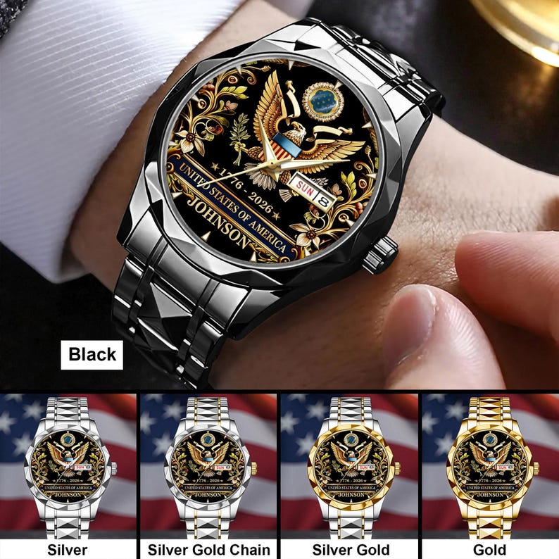 May include: A black wristwatch with a stainless steel band. The watch face features a gold eagle design, the text "UNITED STATES OF AMERICA", and the name "JOHNSON". The watch also displays the date "SUN 8" and the years "1776-2026".