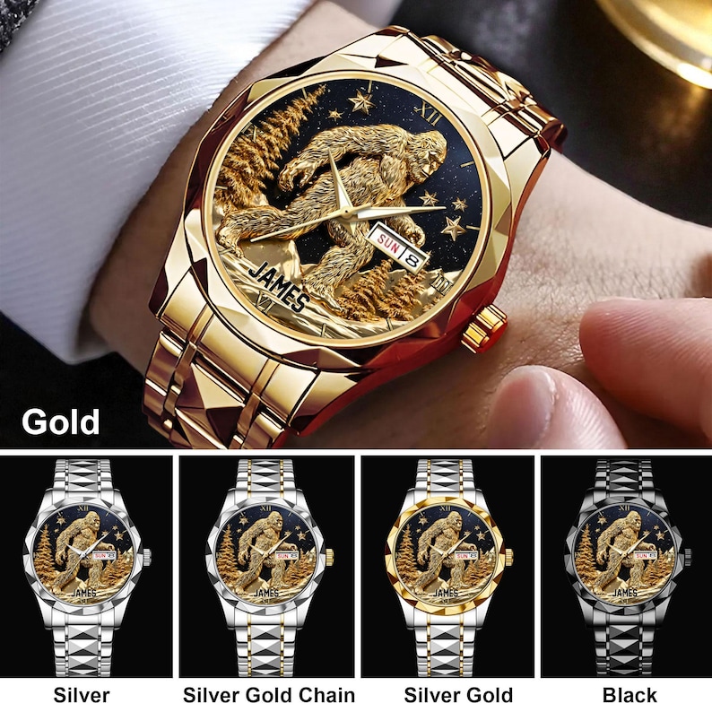 May include: Gold-toned wristwatch with a detailed Sasquatch design on the face. The watch features a gold band and a black and gold face with the word "JAMES" and the day of the week. Additional watch options include silver, silver gold chain, silver gold, and black.