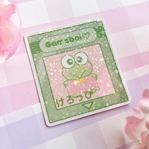 Gameboi Cart cute frog holographic vinyl stickers - pastel video game kawaii water bottle laptop phone case pc japanese characters green