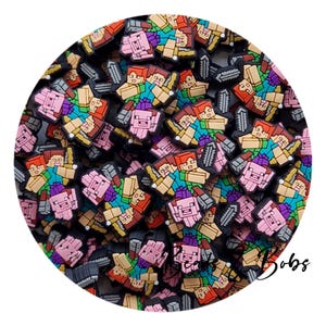May include: A collection of colourful, pixelated character charms, featuring figures with red, pink, and green tops, and swords. The charms are arranged in a circular pattern, with a variety of colours and designs.