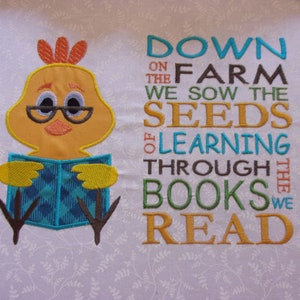 May include: Embroidered design featuring a yellow chick wearing glasses and reading a book. The text reads "Down on the farm we sow the seeds of learning through the books we read".