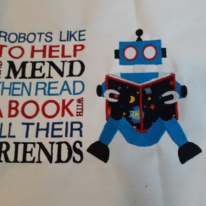 May include: A blue robot with red eyes is reading a book with stars and a moon on the cover. The text reads "Robots like to help and mend then read a book with all their friends".