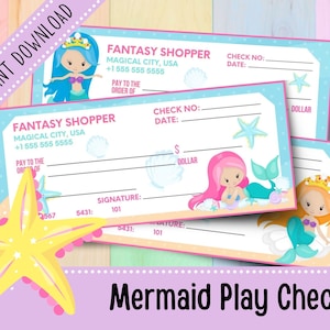 May include: Three printable mermaid play checks with a blue, pink, and orange mermaid illustration on each. The checks have lines for writing in the check number, date, amount, and signature. The text "Fantasy Shopper" is printed at the top of each check.