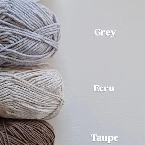 May include: Five stacked balls of yarn in white, grey, ecru, taupe, and lemon colours. Each ball is labelled with its corresponding colour name in white text to the right: White, Grey, Ecru, Taupe, and Lemon. The yarn has a twisted texture.