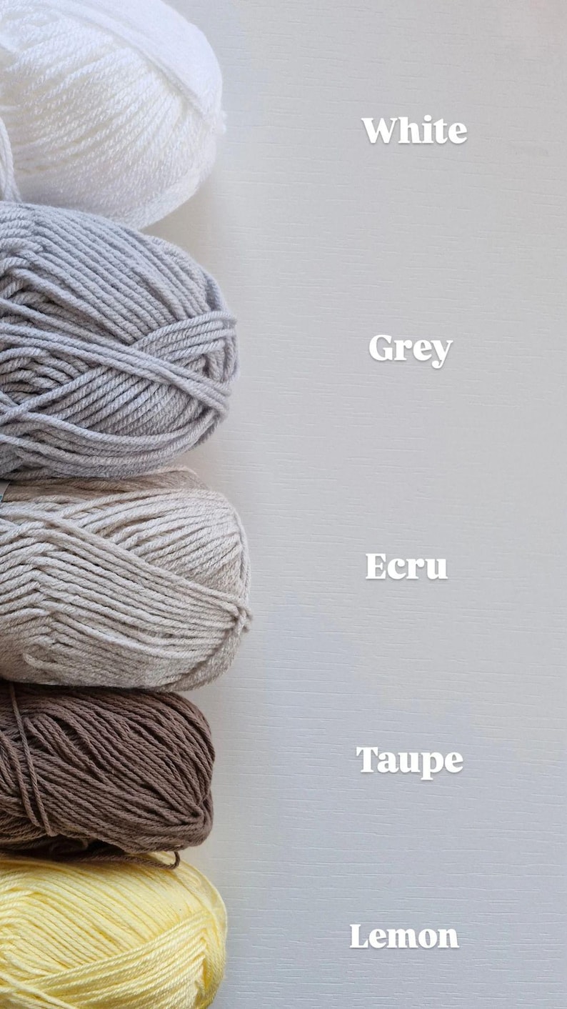 May include: Five stacked balls of yarn in white, grey, ecru, taupe, and lemon colours. Each ball is labelled with its corresponding colour name in white text to the right: White, Grey, Ecru, Taupe, and Lemon. The yarn has a twisted texture.