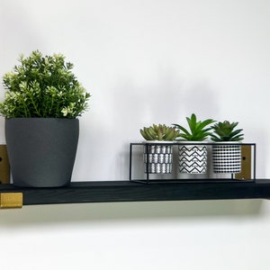 black & gold shelf with J style brackets