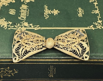 Broche antique de noeud papillon en filigrane