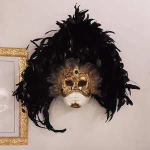 Eyes wide shut handmade Venetian mask in gold leaf papier-mâché, crystals, macrame and trimmings