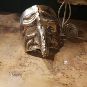 Venetian papier-mâché pantaloon mask with gold and silver leaf decoration