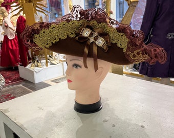 Traditional tricorn hat for men and women, made of wool, with velvet trim, decorated with Burano lace, trimmings and Swarovski crystals.