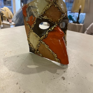 Venetian papier-mâché Bauta Casanova mask with gold leaf and baroque decorations