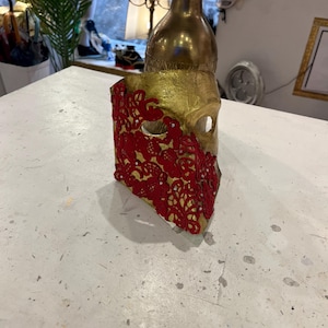 Venetian papier-mâché Bauta Casanova mask with gold leaf and baroque decorations