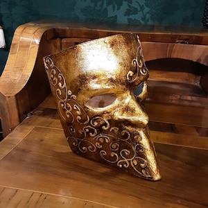 Venetian papier-mâché Bauta Casanova mask with gold leaf and baroque decorations
