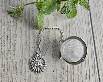 Stainless steel loose leaf tea strainer with sun charm