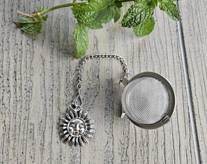 Stainless steel loose leaf tea strainer with sun charm