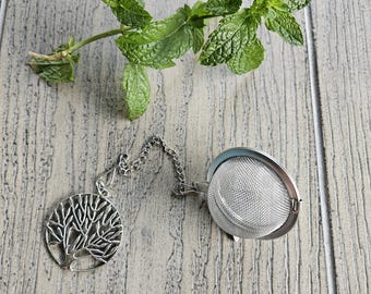 Stainless steel loose leaf tea strainer with tree of life charm