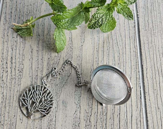 Stainless steel loose leaf tea strainer with tree of life charm