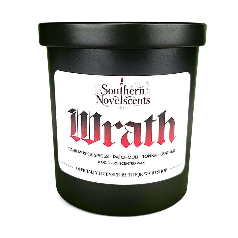 May include: Black scented candle with the word "Wrath" in red gothic font on a white label. The label also includes the text "Southern Novelscents" and scent notes. The candle is 8 oz (226g).