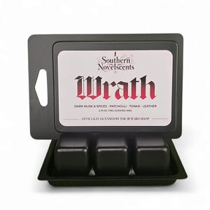 May include: A black wax melt container with three cubes, labeled "Wrath" by Southern Novelscents. The label lists dark musk, spices, patchouli, tonka, and leather scents. The wax weighs 2.75 oz (78g).