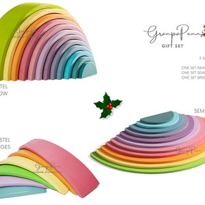 May include: A set of three pastel rainbow wooden arch stacking toys. The set includes a rainbow arch, a set of semicircles, and a set of bridges. The toys are made of natural wood and are painted in soft pastel colors. The set is perfect for children of all ages and can be used for a variety of activities, such as building, stacking, and imaginative play.