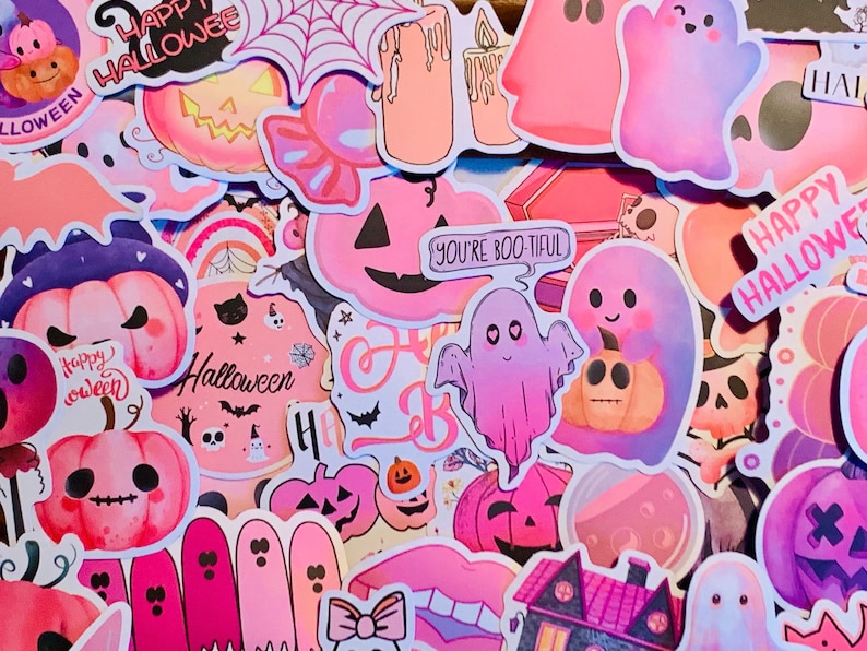 May include: A collection of pink and purple Halloween stickers featuring ghosts, pumpkins, bats, and the text "Happy Halloween".