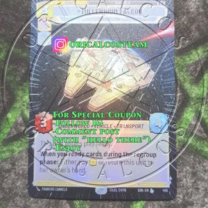 May include: A Star Wars collectible card featuring the Millennium Falcon spaceship. The card is blue and silver with a green background. The card text reads "For Special Coupon - Follow IG - Comment Post (With "Hello There") - Enjoy".
