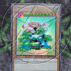 May include: A blue and green Pokemon card featuring Venusaur, a plant-type Pokemon. The card has a holographic finish and features the text "ORICALCOSTEAM" and "FOR SPECIAL COUPON -FOLLOW IG -COMMENT POST (WITH "HELLO THERE") -ENJOY".