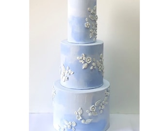 Light blue with floral decoration fake cake for display