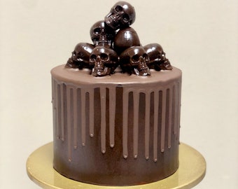 Chocolate drip cake with skull decoration
