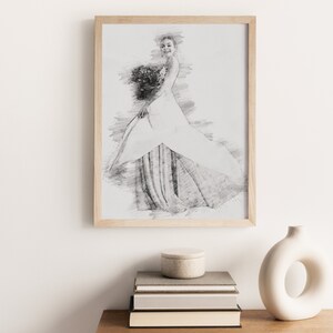 May include: A framed black and white pencil sketch of a woman in a wedding dress holding a bouquet of flowers.