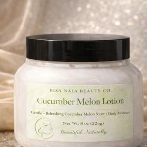 May include: A white jar of Cucumber Melon Lotion with a black lid. The label reads "BISA NALA BEAUTY CO." and "Cucumber Melon Lotion." It also states "Net Wt. 8 oz (226g)." The lotion is described as gentle, refreshing, and for daily moisture.