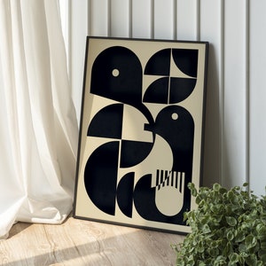 May include: A black and white geometric abstract art print in a black frame. The print features a design of overlapping circles and semi-circles on a cream background.