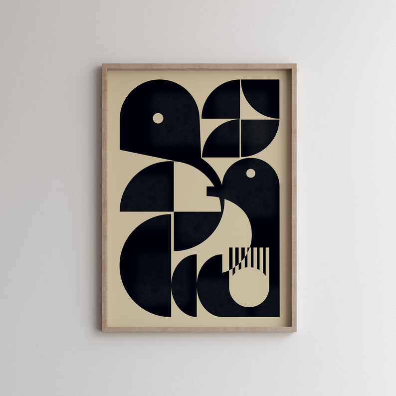 May include: Abstract geometric art print featuring a black and white design of a bird with a beige background. The print is framed in a light wood frame.