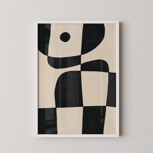 May include: Abstract art print featuring black and beige geometric shapes. The print includes a large black circle and a series of curved lines and squares.