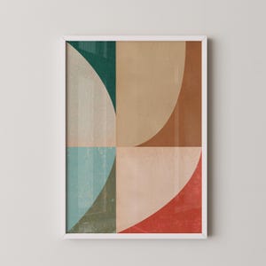 Peut inclure: Impression d'art géométrique abstrait avec un cadre blanc. L'impression présente un motif de cercles qui se chevauchent dans des tons de bleu sarcelle, bleu, marron et rouge.