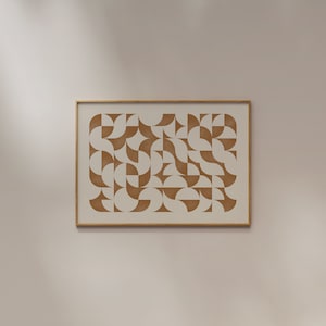 May include: A framed print with a geometric pattern of brown semi-circles on a white background.