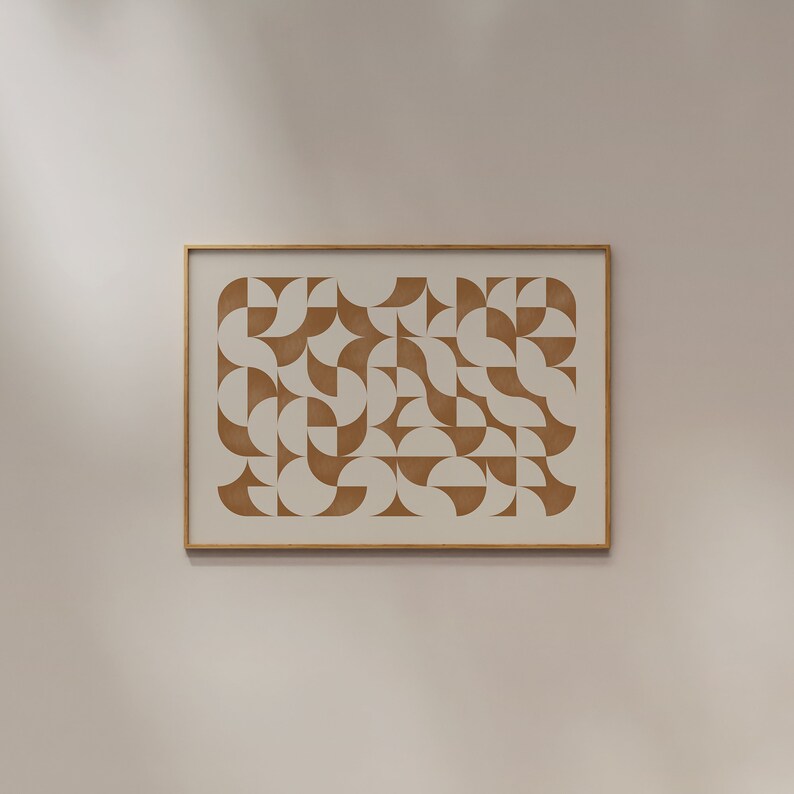May include: A framed print with a geometric pattern of brown semi-circles on a white background.