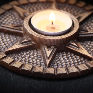 Candle holder made of wood related to Ishtar Goddess