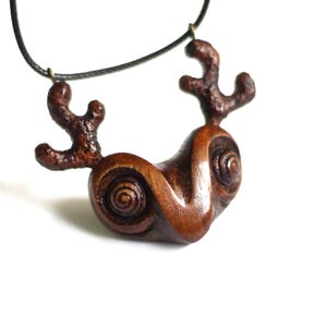 Wooden horned forest spirit. Mystic forest animal necklace. Wood carving pagan amulet pendant. Small fertility god. Wiccan decor